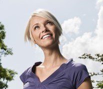 A girl looking up while smiling